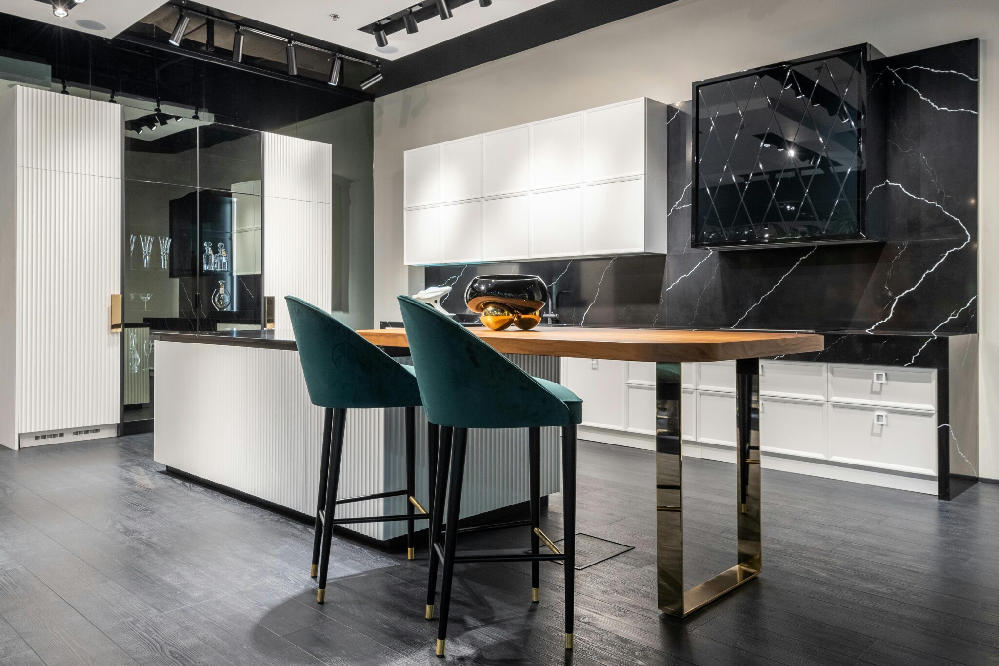 Contemporary kitchen design with sleek black marble and minimalist decor, ideal for modern living spaces.